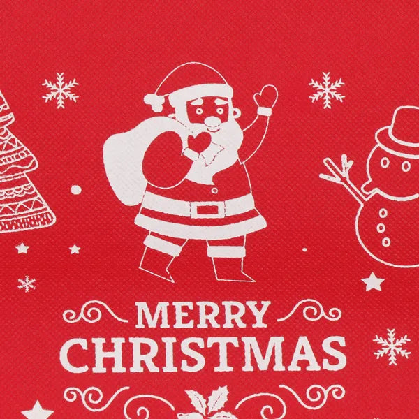 Ajándéktasak 36x24,5 cm, piros–fehér–zöld, hópehely és Mikulás mintával, műanyag