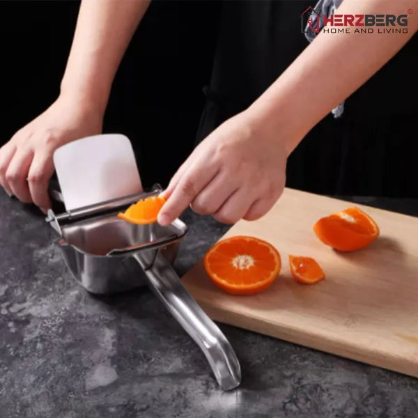 Rozsdamentes acél kézi citrusprés ergonomikus fogantyúval, ezüst